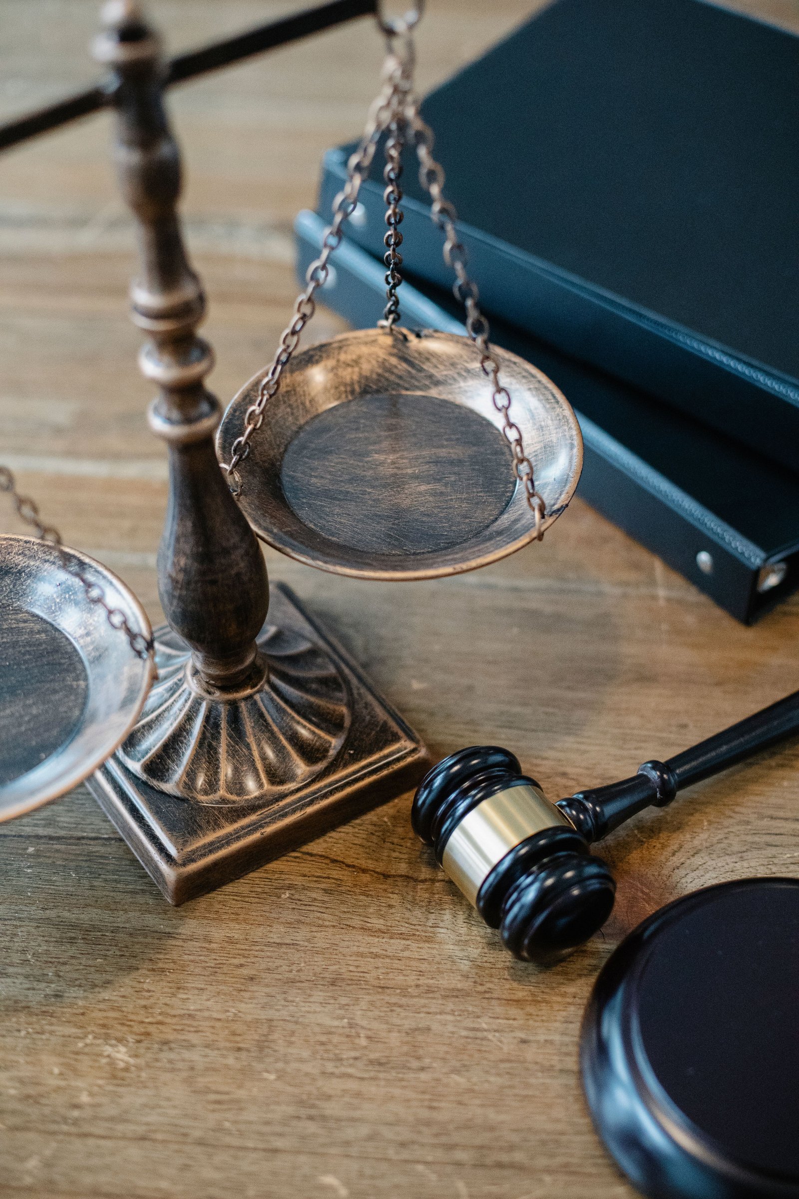 Scales of justice, legal books, and a gavel.