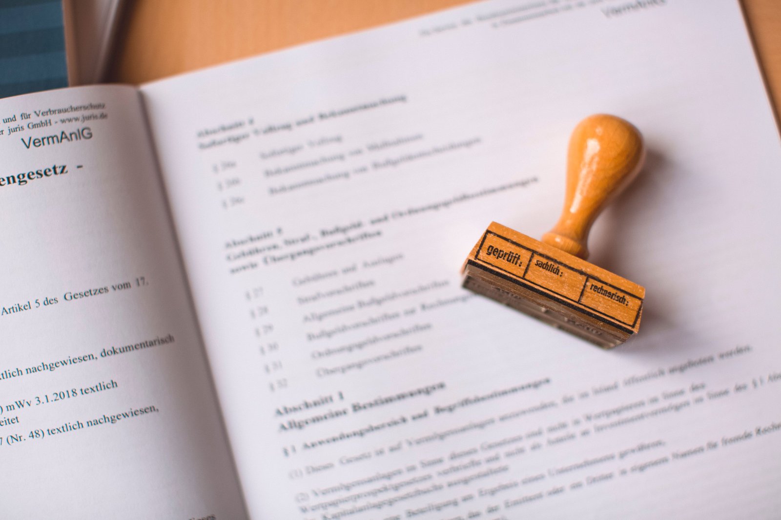 A legal reference book with an official stamp.